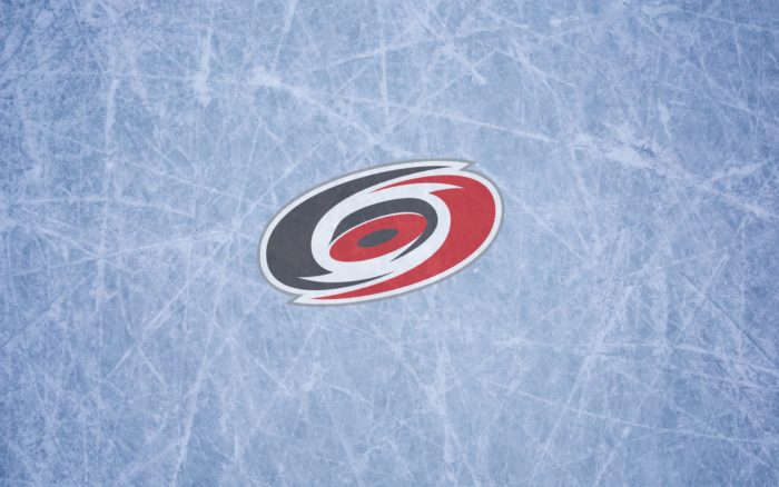 Carolina Hurricanes wallpaper with logo on the ice 1920x1200, 16x10
